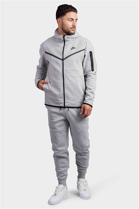 nike trainingspak heren grijs|joggingpakken heren.